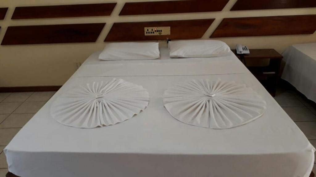 Postel nebo postele na pokoji v ubytování Coroa Bella Praia Hotel