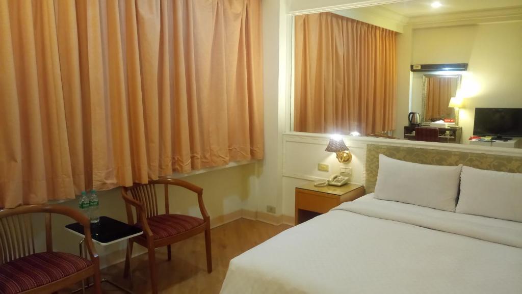 Postel nebo postele na pokoji v ubytování 苓雅大飯店 Lingyea Hotel
