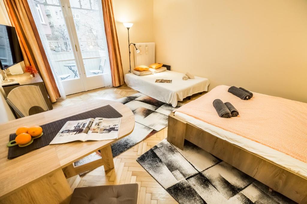 TV a/nebo společenská místnost v ubytování BpR Orange Dream Apartment