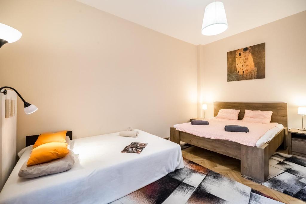 Postel nebo postele na pokoji v ubytování BpR Orange Dream Apartment