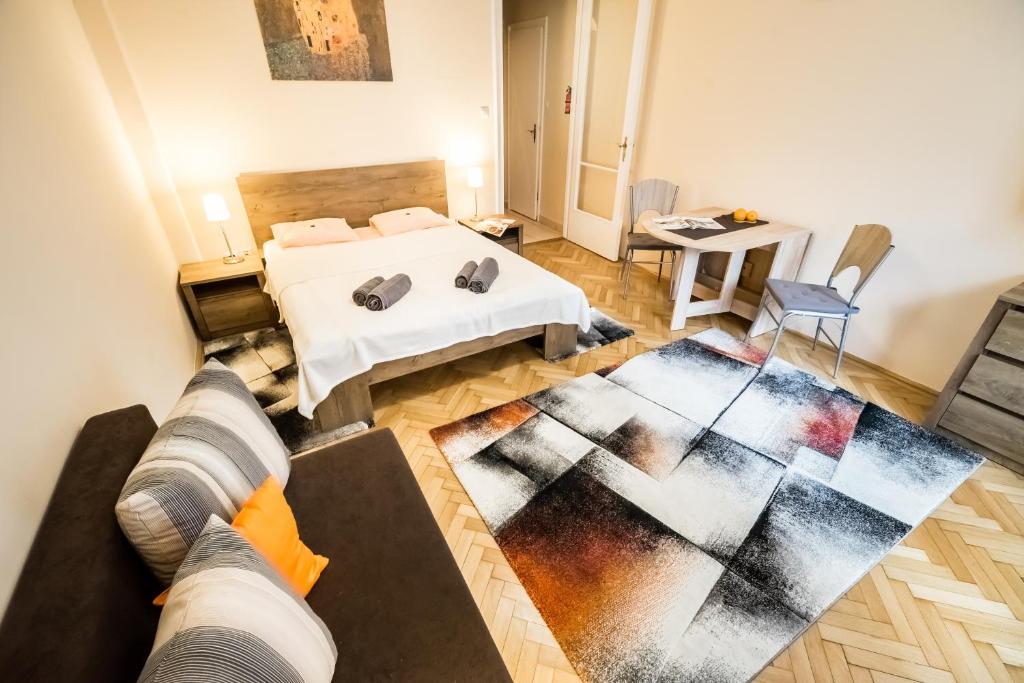Postel nebo postele na pokoji v ubytování BpR Orange Dream Apartment