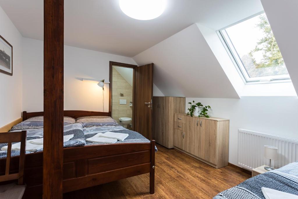 Postel nebo postele na pokoji v ubytování Attic Rooms Tábor
