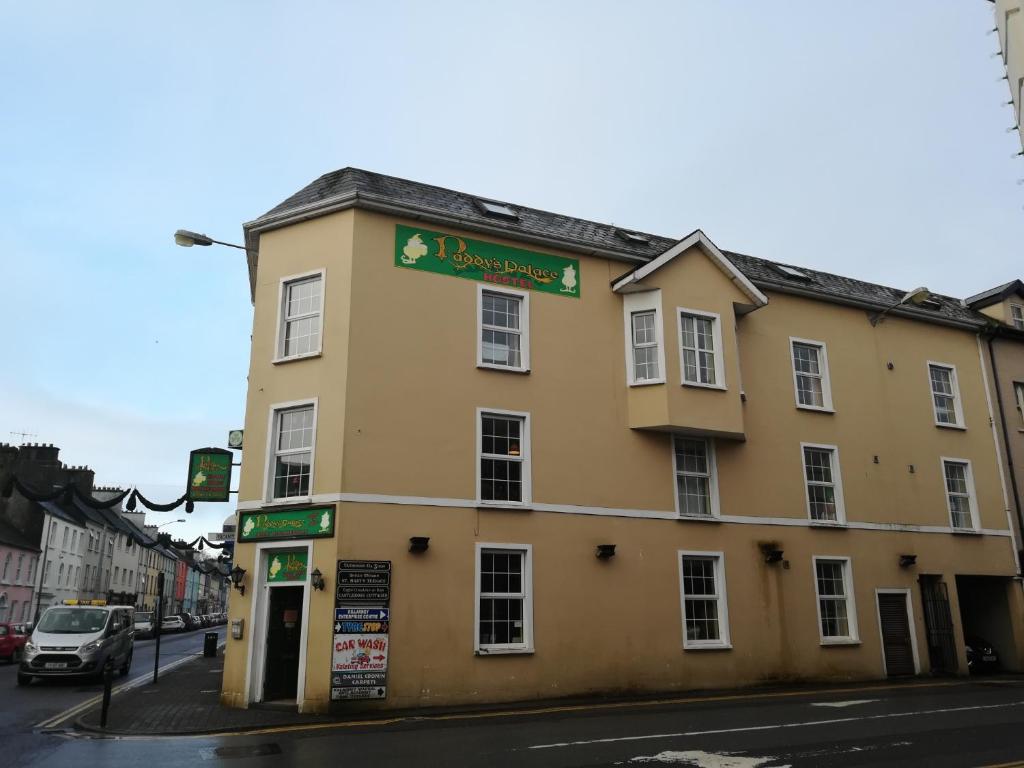 a building on the corner of a street at Paddy's Palace Kilarney in Killarney