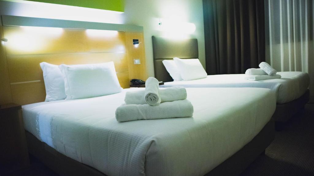 Postel nebo postele na pokoji v ubytování iH Hotels Milano Gioia