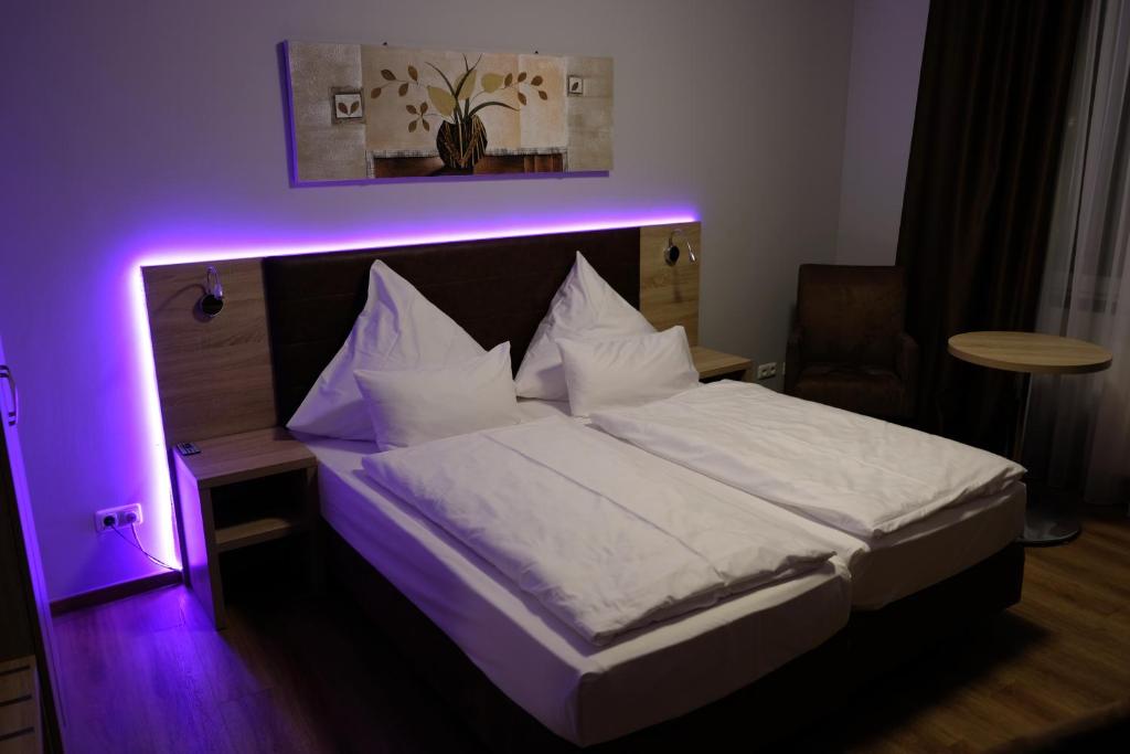 Postel nebo postele na pokoji v ubytování Minx – CityHotels