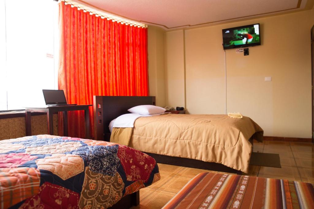 Postel nebo postele na pokoji v ubytování Mashy´s Hostal