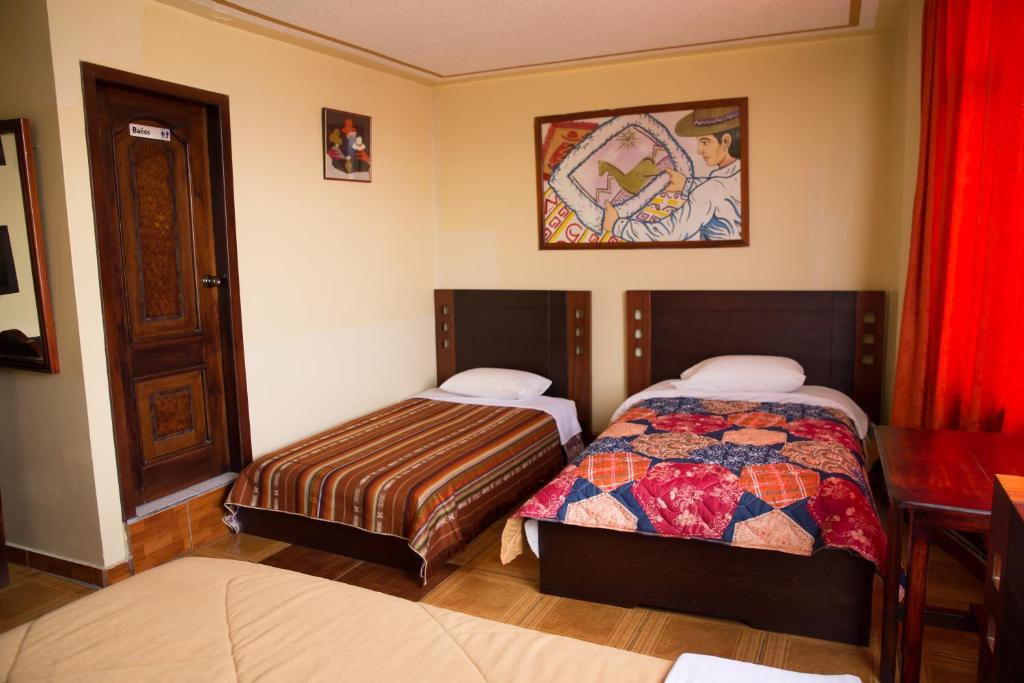 Postel nebo postele na pokoji v ubytování Mashy´s Hostal