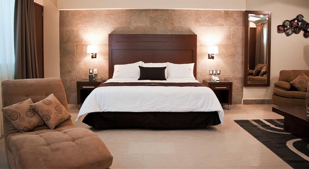 Postel nebo postele na pokoji v ubytování Hotel Ecce Inn & Spa