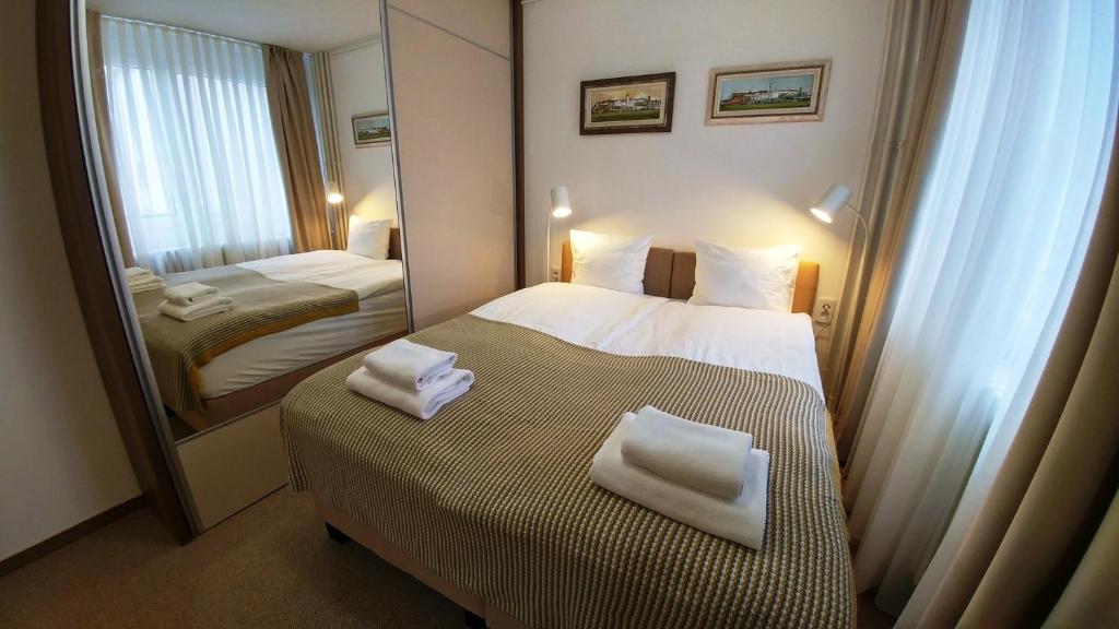 Postel nebo postele na pokoji v ubytování Dafni Apartment