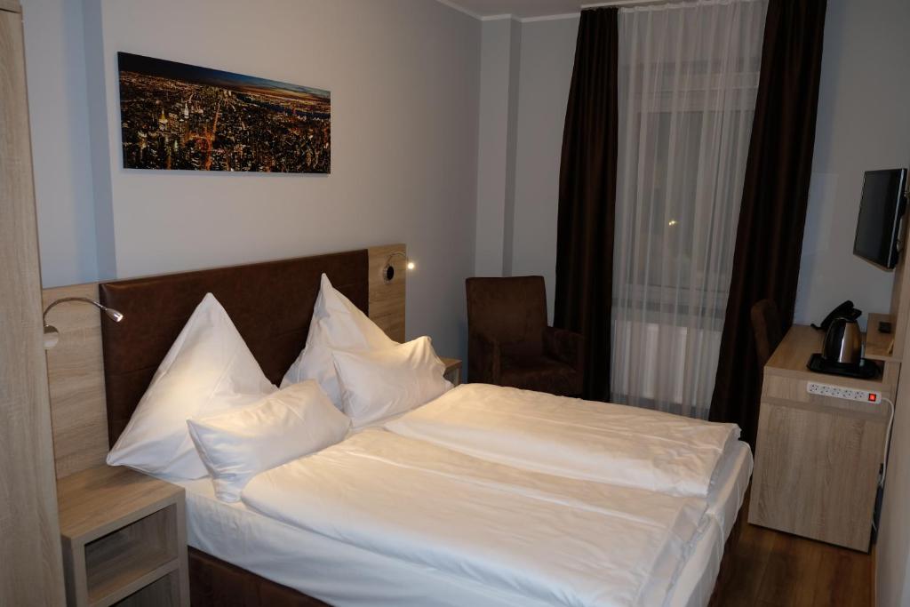 Postel nebo postele na pokoji v ubytování Minx – CityHotels