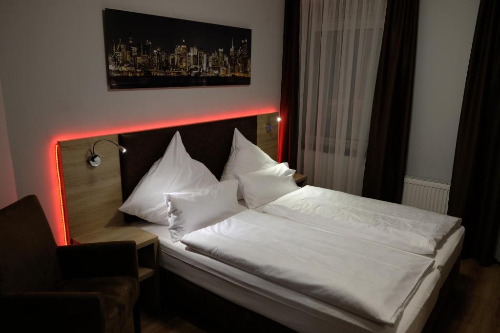 Postel nebo postele na pokoji v ubytování Minx – CityHotels