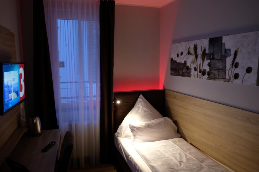 Postel nebo postele na pokoji v ubytování Minx – CityHotels