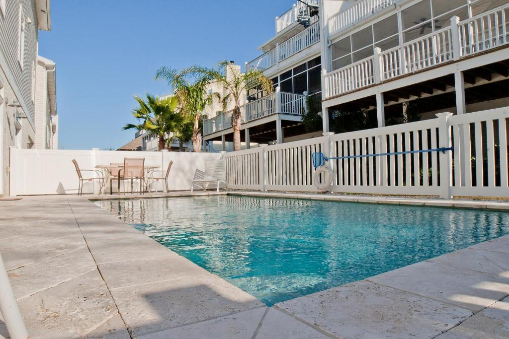 a swimming pool in front of a building at DeSoto Beach Vacation Properties in Tybee Island