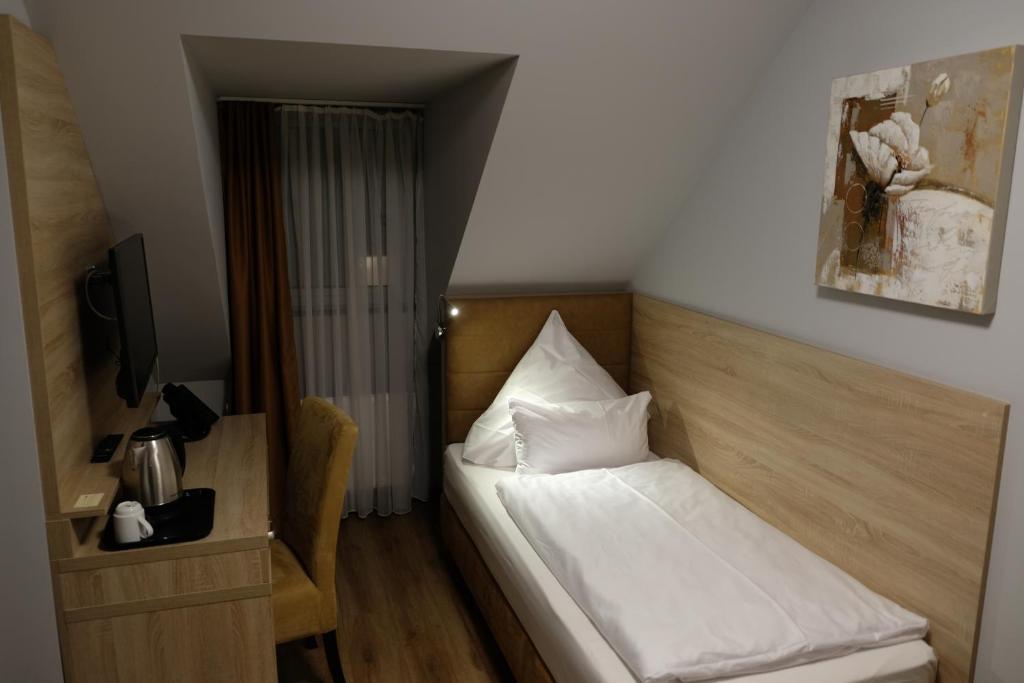 Postel nebo postele na pokoji v ubytování Minx – CityHotels
