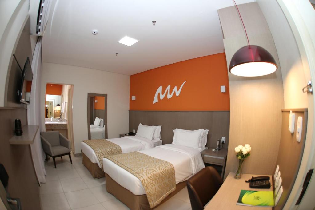 Cama ou camas em um quarto em Real Classic Bahia Hotel