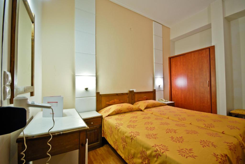 Posteľ alebo postele v izbe v ubytovaní Hotel Coronis