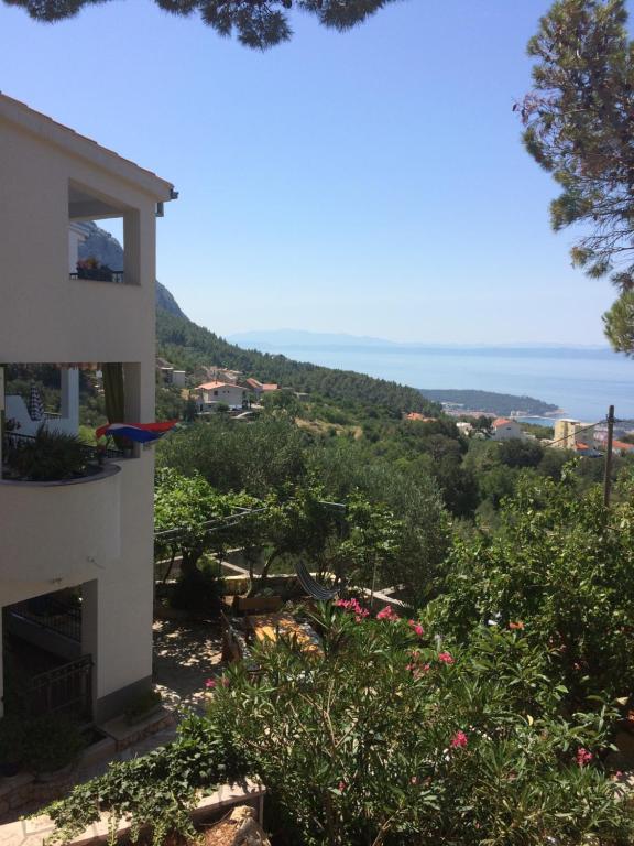 a view of the ocean from a house at Apartments Panorama in Makarska