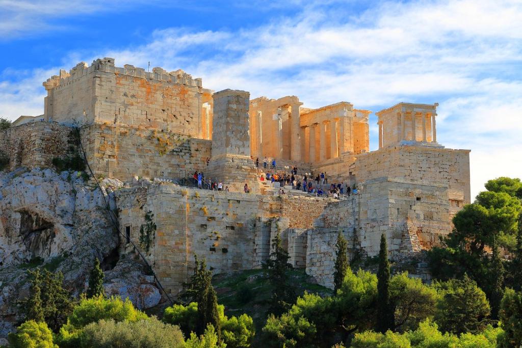 a group of people standing on top of a mountain at Tranquil Central Apt, behind Athens Caravel Area in Athens