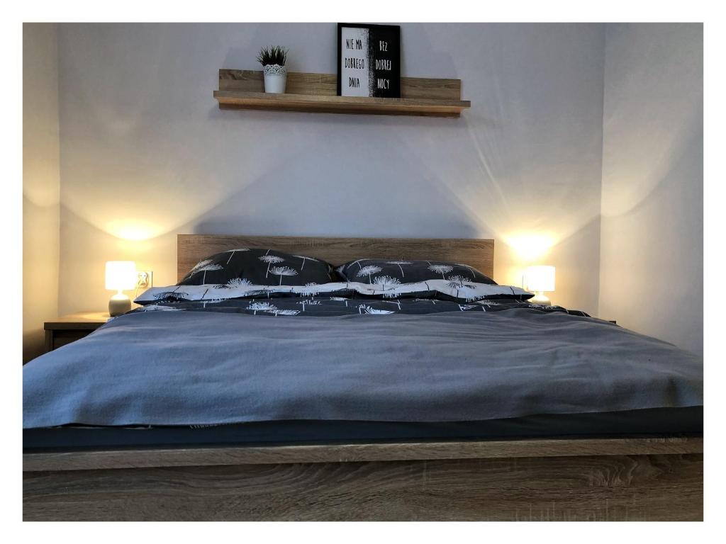 Posteľ alebo postele v izbe v ubytovaní Apartament przy Ratuszu