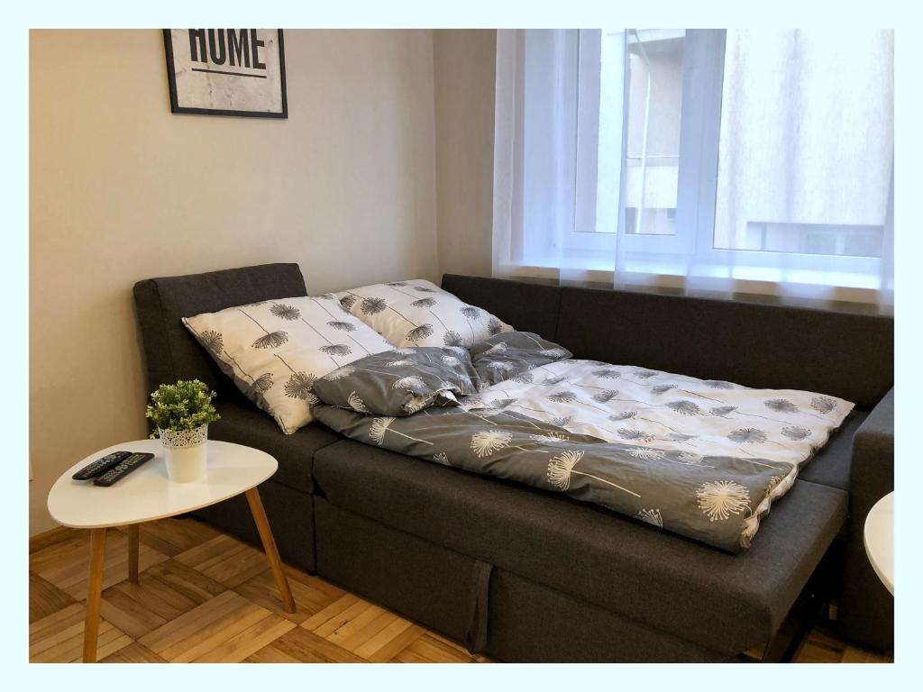 Posteľ alebo postele v izbe v ubytovaní Apartament przy Ratuszu
