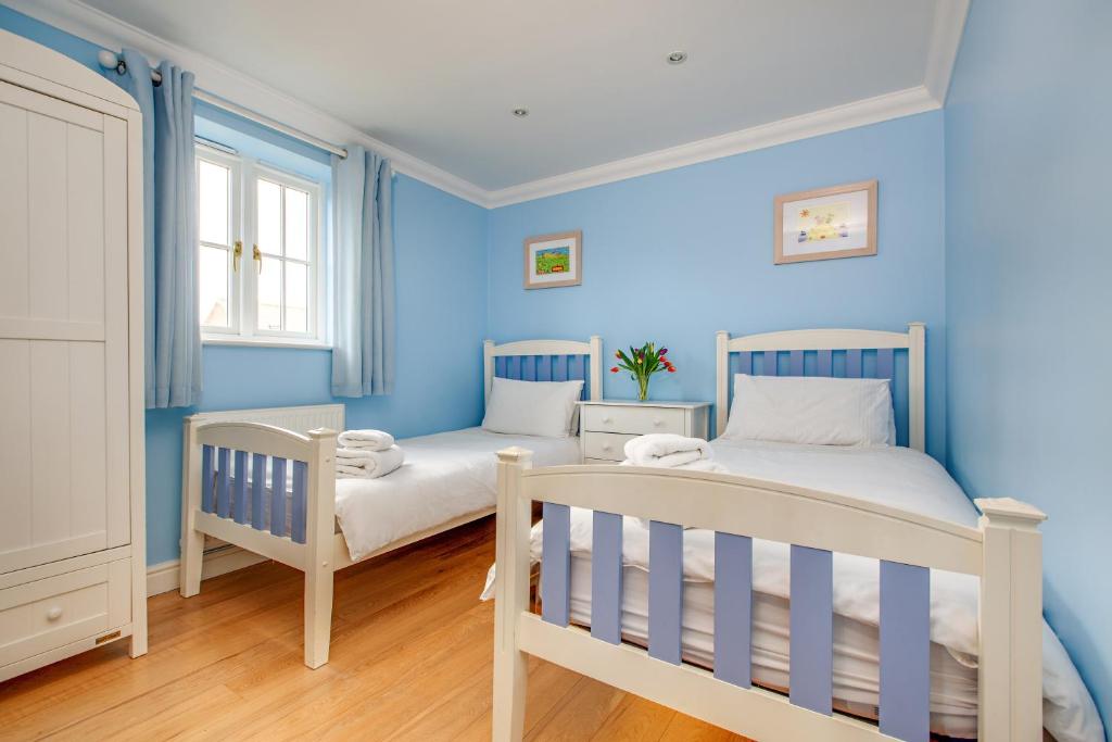Кровать или кровати в номере Tolly House