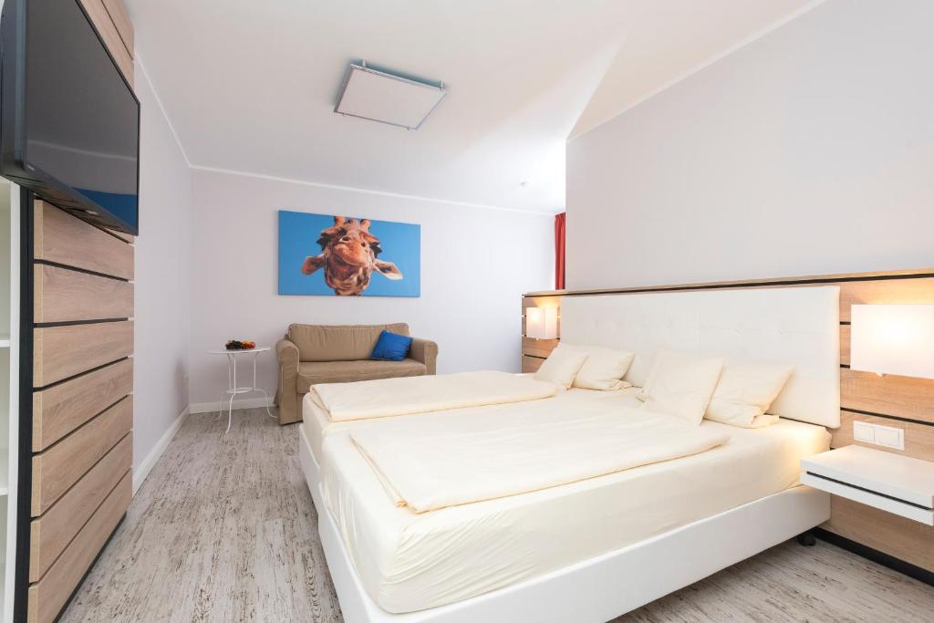 Postel nebo postele na pokoji v ubytování Hotel Tiek Superior