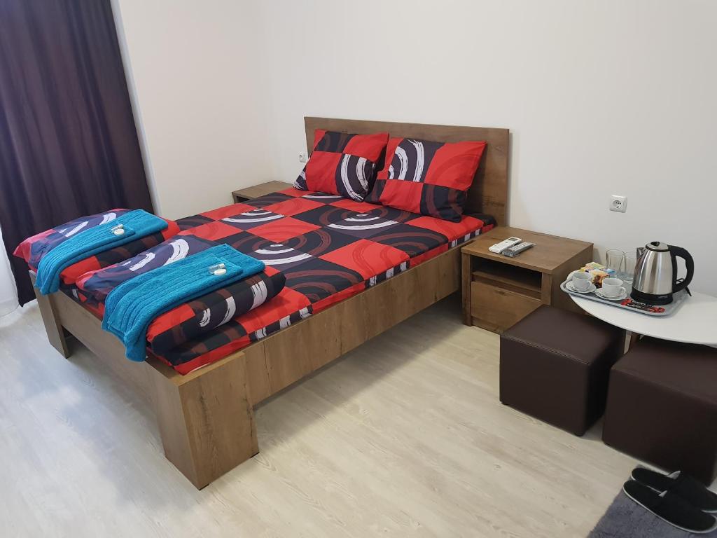 En eller flere senge i et værelse på Apartments Alexandra