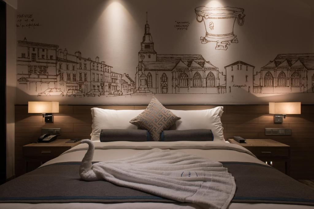 Chengdu Prolit Hotel tesisinde bir odada yatak veya yataklar