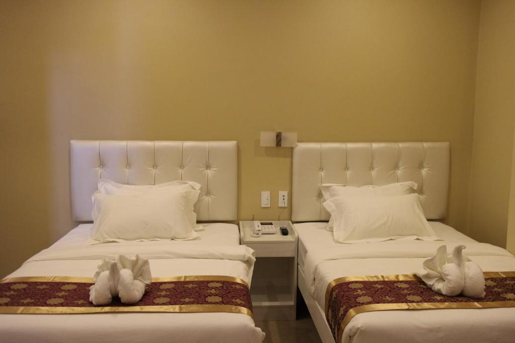 Postel nebo postele na pokoji v ubytování Southview Hotel