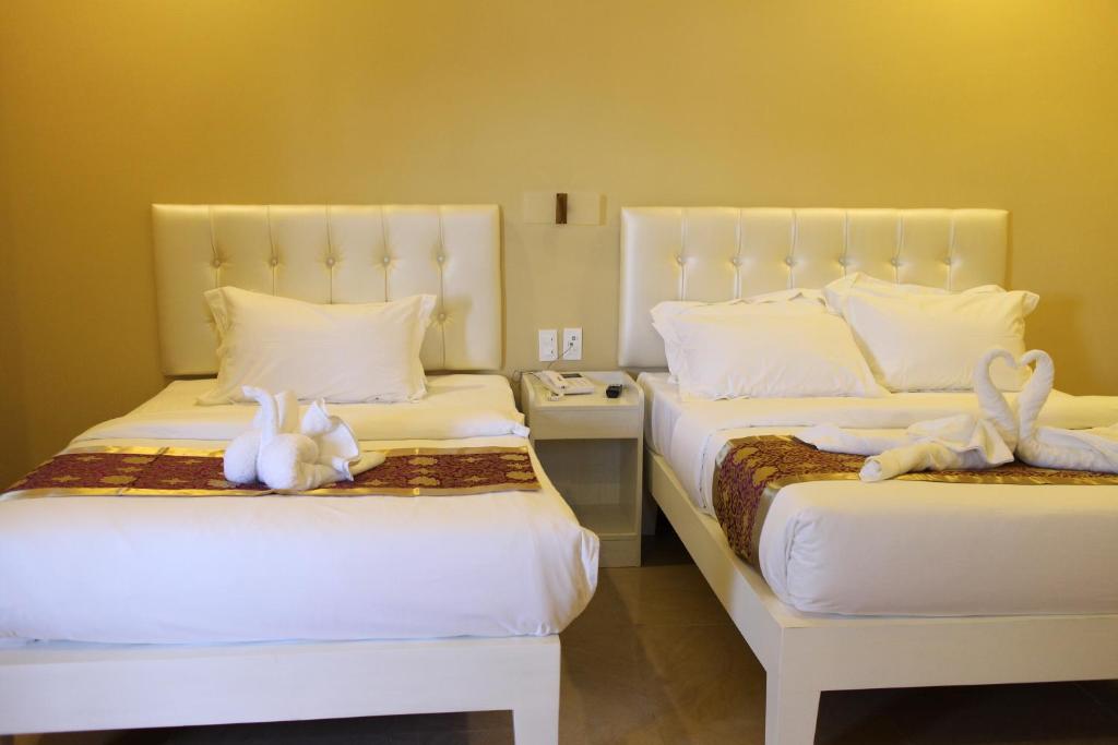 Postel nebo postele na pokoji v ubytování Southview Hotel