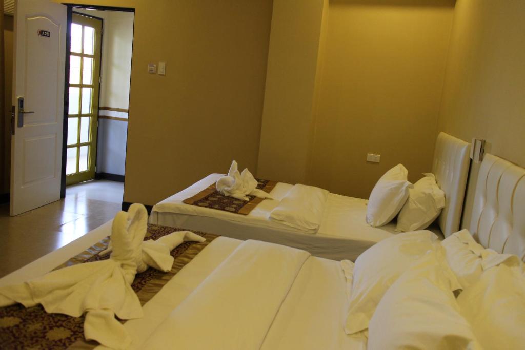 Postel nebo postele na pokoji v ubytování Southview Hotel