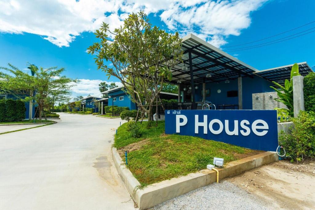 a sign that reads p house in front of a house at P House in Kanchanaburi City