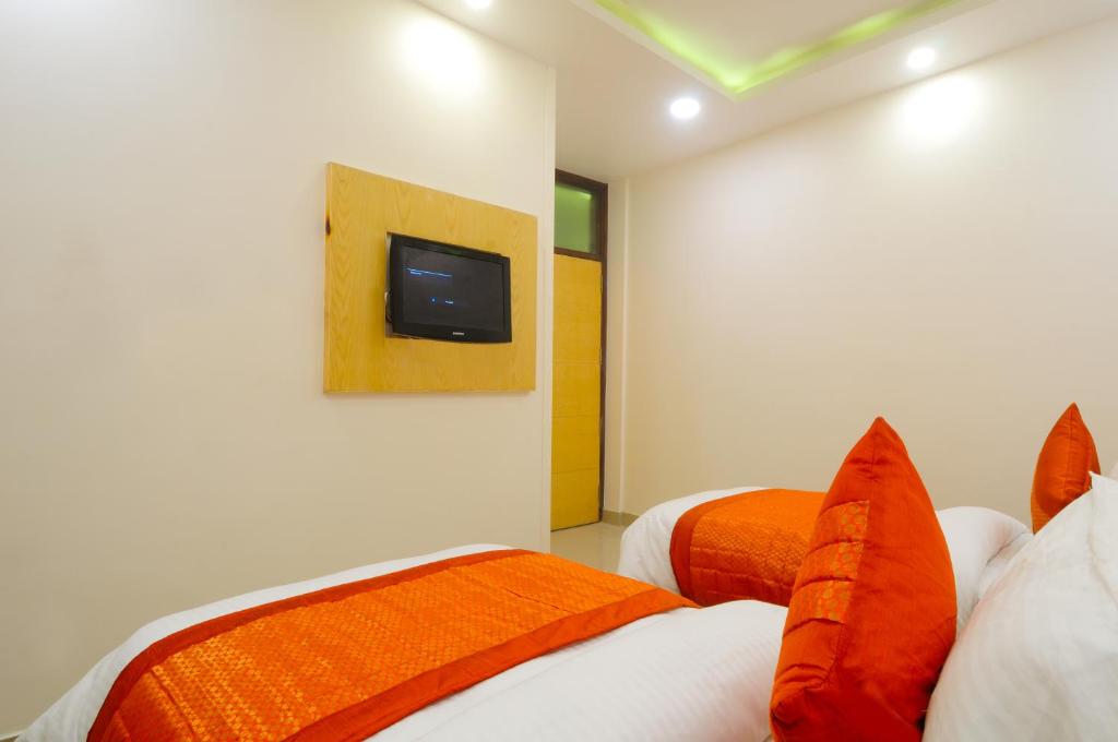 Postel nebo postele na pokoji v ubytování The Gold Inn - Paharganj