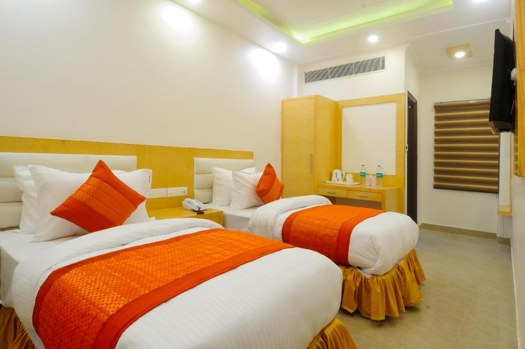 Postel nebo postele na pokoji v ubytování The Gold Inn - Paharganj