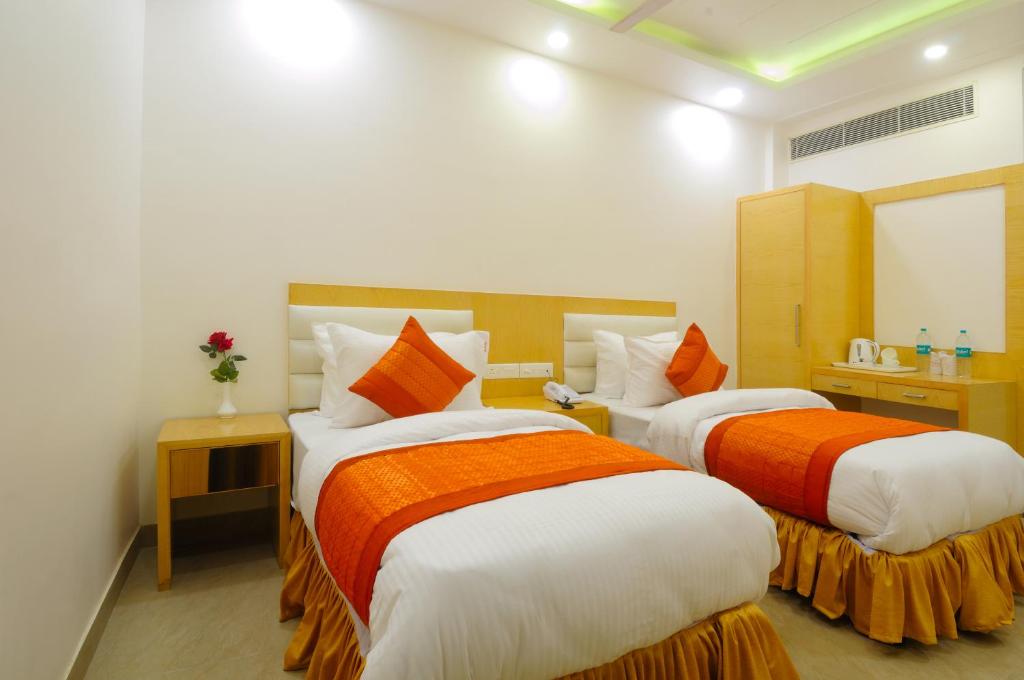 Postel nebo postele na pokoji v ubytování The Gold Inn - Paharganj