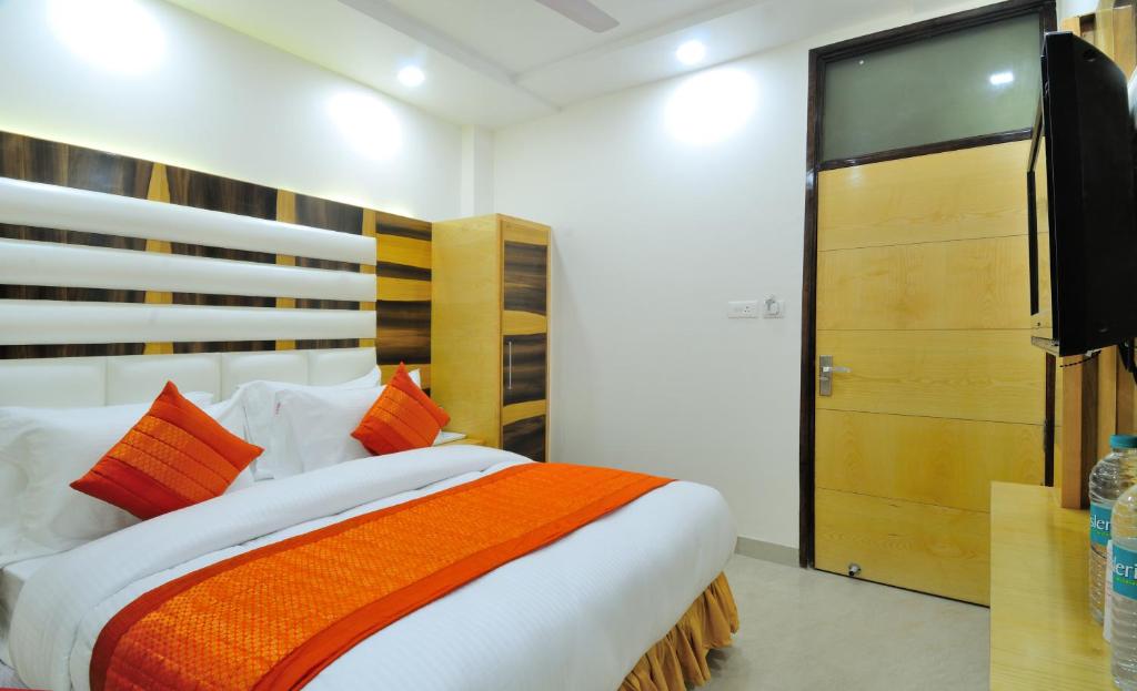 Postel nebo postele na pokoji v ubytování The Gold Inn - Paharganj