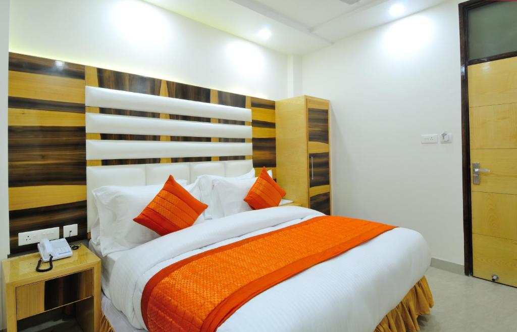 Postel nebo postele na pokoji v ubytování The Gold Inn - Paharganj