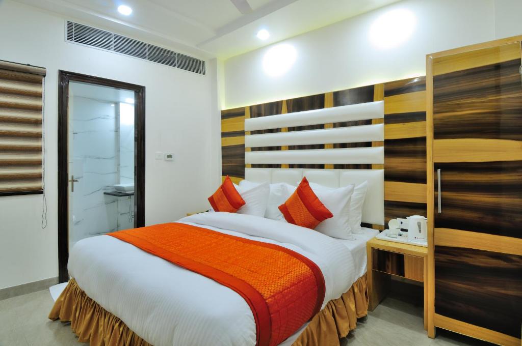 Postel nebo postele na pokoji v ubytování The Gold Inn - Paharganj