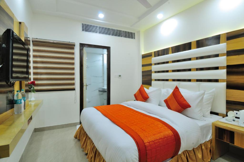 Postel nebo postele na pokoji v ubytování The Gold Inn - Paharganj