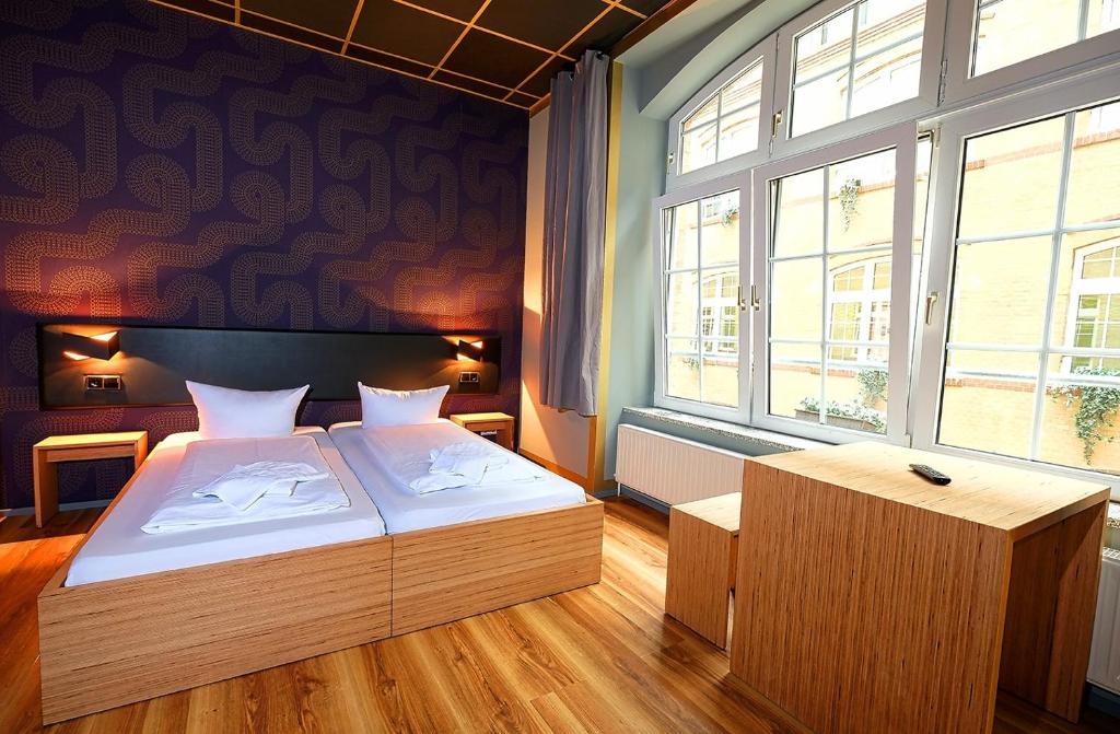Postel nebo postele na pokoji v ubytování Singer109 Hostel, Hotel & Apartment