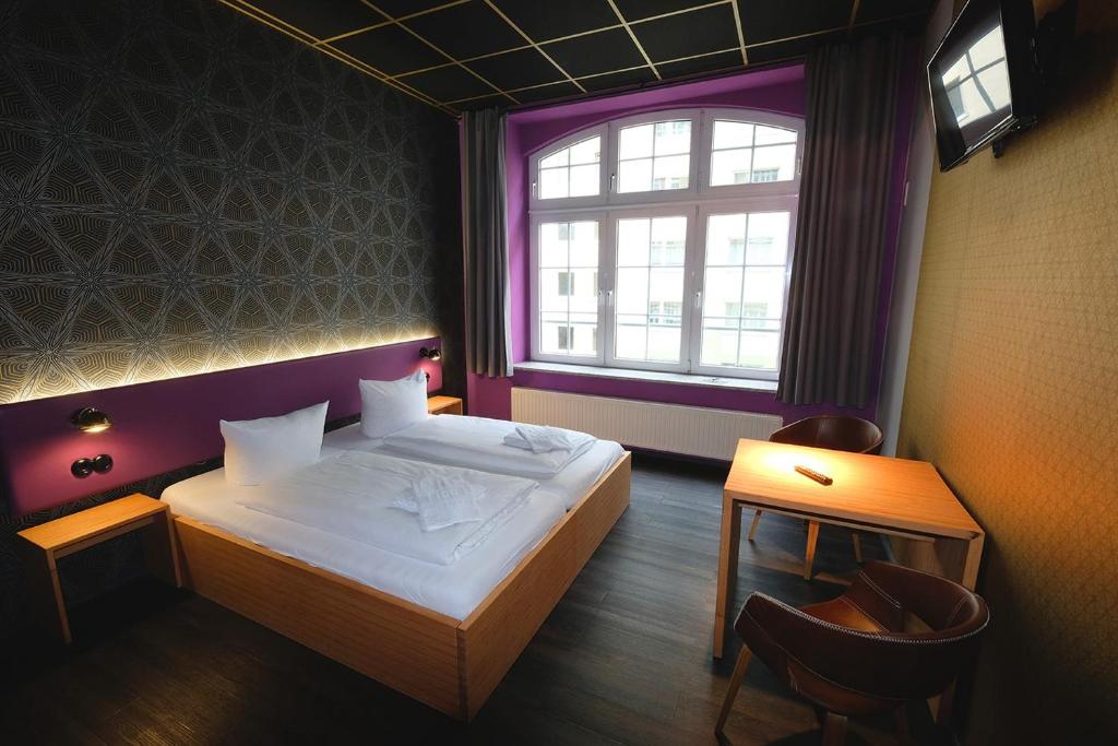 Postel nebo postele na pokoji v ubytování Singer109 Hostel, Hotel & Apartment