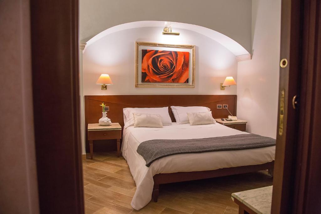 Postel nebo postele na pokoji v ubytování Palmed Hotel