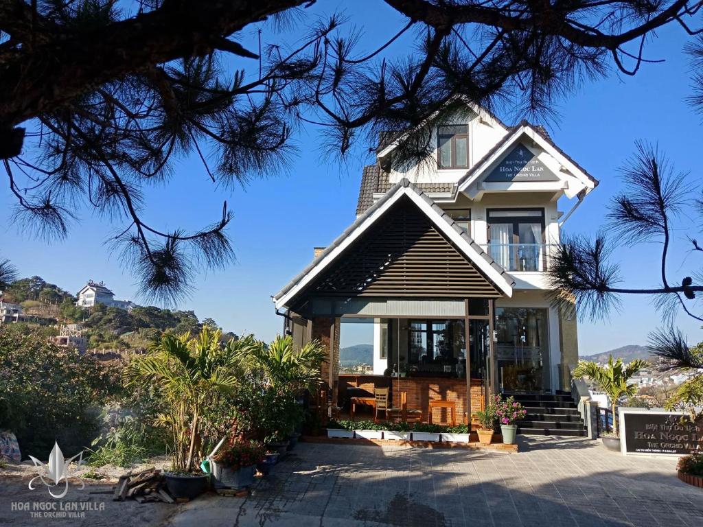 a house with a view of the ocean at The Orchid Villa Dalat in Da Lat