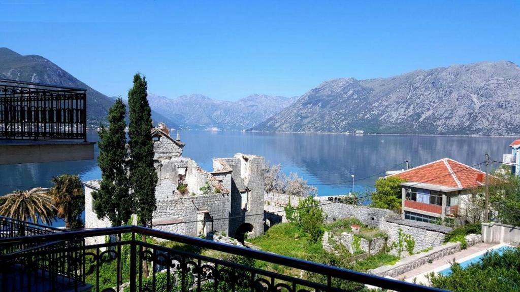 a view of a body of water from a balcony at Apartments Coral in Kotor