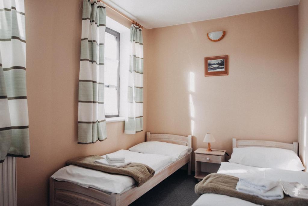 Postel nebo postele na pokoji v ubytování Červený Mlýn