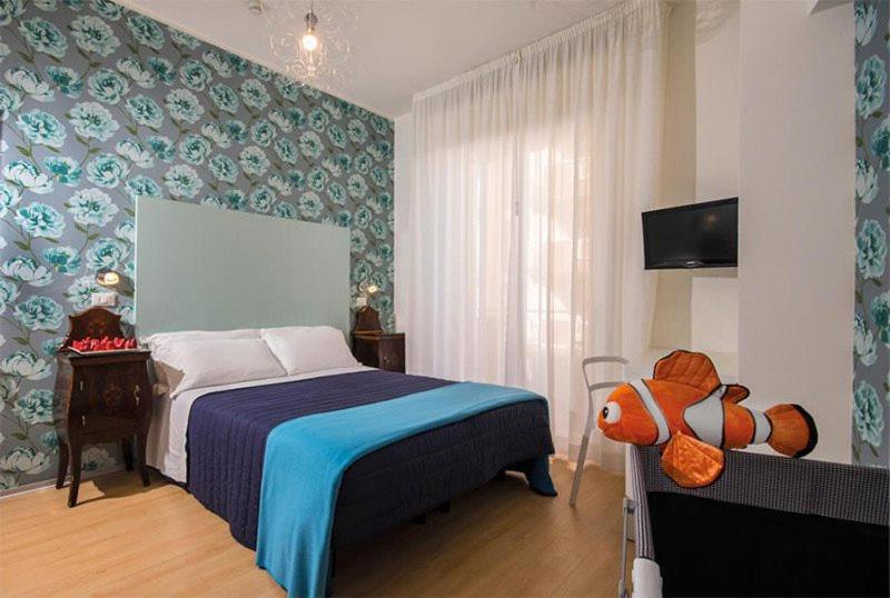 Postel nebo postele na pokoji v ubytování Hotel Trafalgar