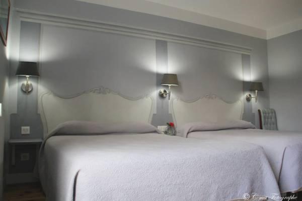 Postel nebo postele na pokoji v ubytování Hôtel Majestic