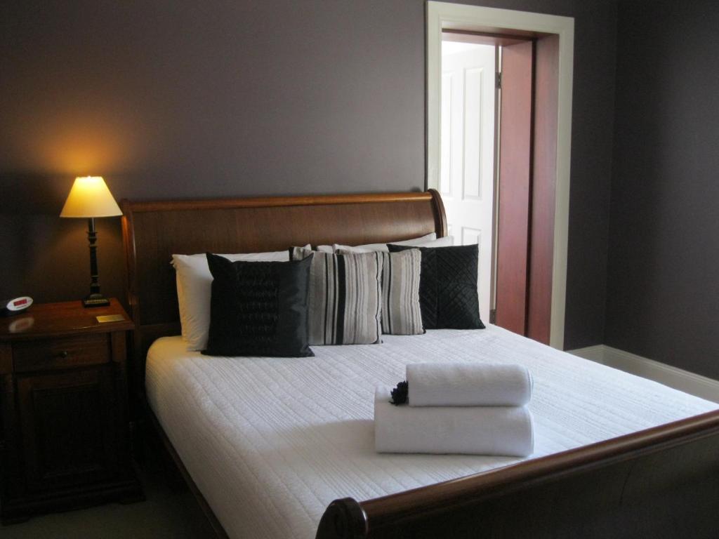 Postel nebo postele na pokoji v ubytování Heritage Guesthouse