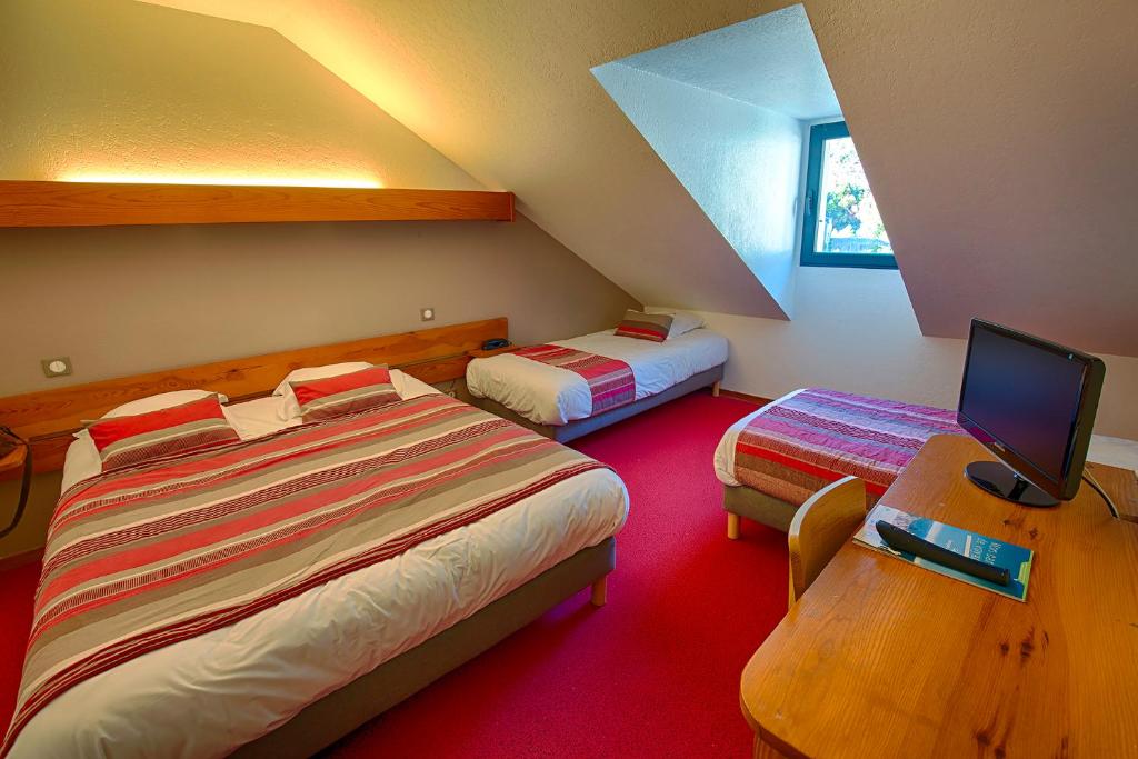 Postel nebo postele na pokoji v ubytování Auberge du Moulin