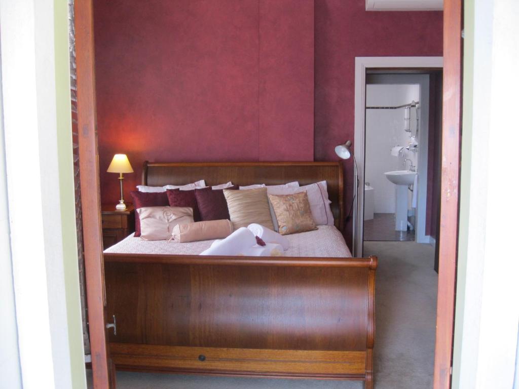 Postel nebo postele na pokoji v ubytování Heritage Guesthouse